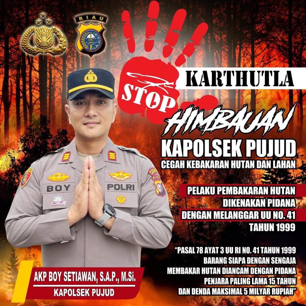 Personel Polsek Pujud Gencarkan Pemasangan Spanduk Himbauan Karhutla 