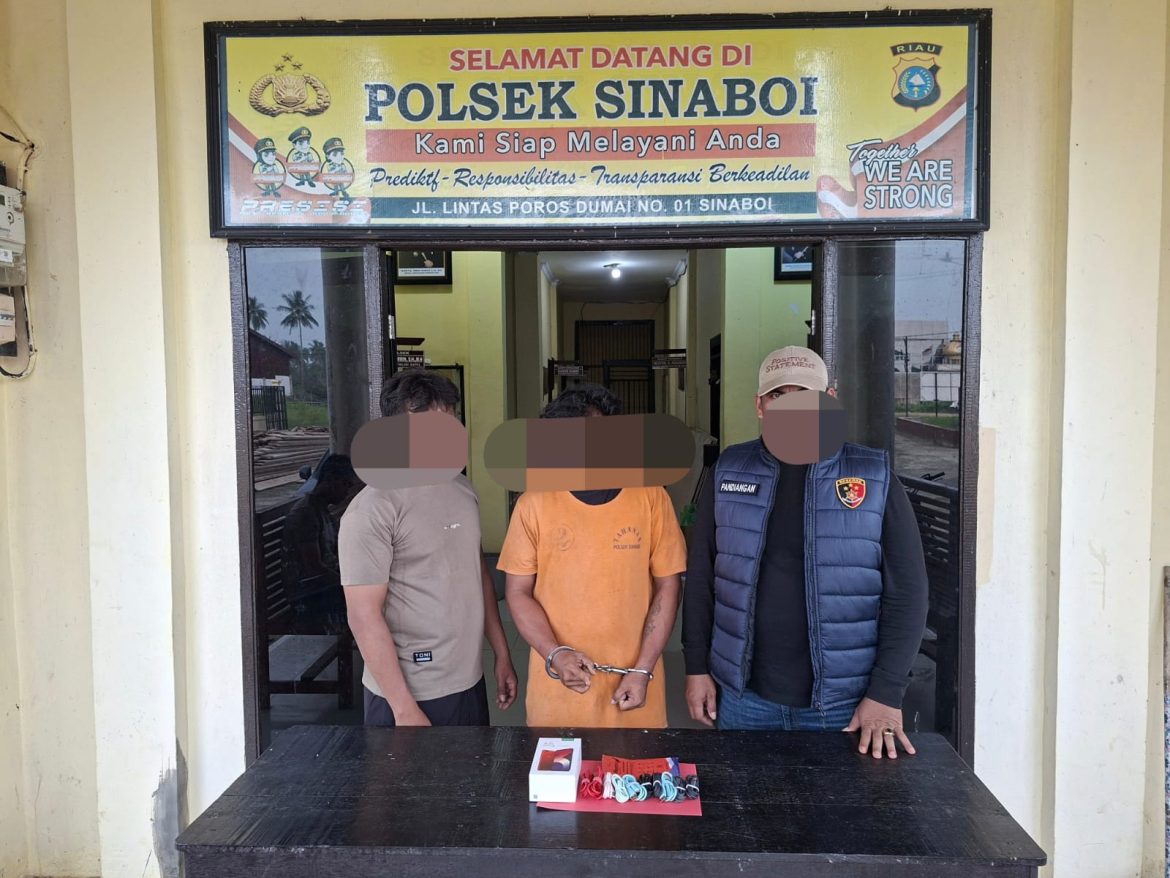 Menyamar Pakai Daster & Kerudung, 3 Orang Bobol Toko HP di Sinaboi — 1 Diamankan, Kerugian Capai Rp40 Juta
